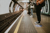 Passengers waiting for a train on a platform 