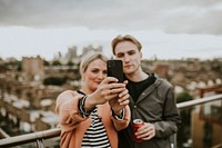 Friends taking a group selfie