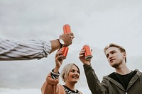 Friends celebrating and toasting on a rooftop