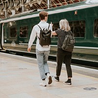 Colleagues travelling together on a train platform 