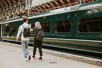 Colleagues travelling together on a train platform 