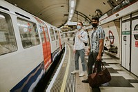 Friends waiting for a train on a platform