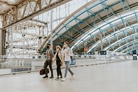 Friends walking towards a train station 