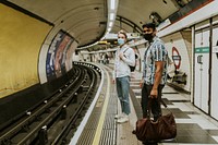 Friends waiting for a train on a platform