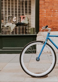 Blue bicycle parked by the street 