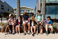 Young adult friends enjoying summer in Venice Beach, Los Angeles