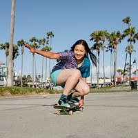 Girl skateboarding, fun outdoors sport activity in Los Angeles