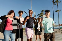 Video content creator dancing with friends in Venice Beach, Los Angeles