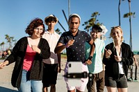 Video content creator dancing with friends in Venice Beach, Los Angeles