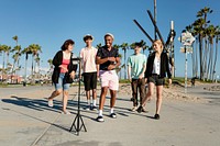 Video content creator dancing with friends in Venice Beach, Los Angeles