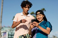 Teen couple take a selfie, summer in Venice Beach, Los Angeles