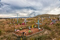 The humble, artistic Shoshone Tribal Cemetery spreads across the undulating prairie outside the town of Fort Washakie, Wyoming.