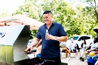 Manning the grill at a tailgate party