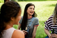 Friends having a picnic in the park