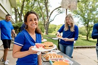 Friends drinking and eating at a tailgate party