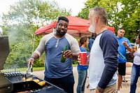 Manning the grill at a tailgate party