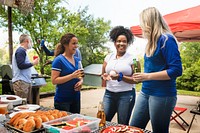 Friends celebrating and eating at a tailgate party