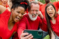 Supporters watching their team win the game on a mobile phone