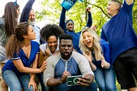 Supporters watching their team win the game on a mobile phone