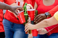 Friends drinking at a tailgate party