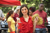 Asian cheerleader at a tailgate party