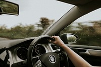 Woman driving a Volkswagen car. 2 FEBRUARY 2021 - BONCATH, WALES, UK