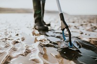 Beach cleanup volunteers picking up trash for environment campaign