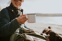 Senior woman camper holding a coffee mug with design space