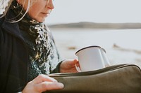 Senior woman camper holding a coffee mug with design space