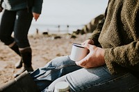 Senior man camper holding a coffee mug with design space