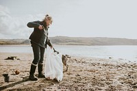 Beach cleanup volunteers picking up trash for environment campaign