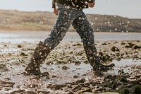 Tourist walking through the beach side trail in Wales 