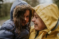 Grandmother holding her grand daughter in her arms happy portrait