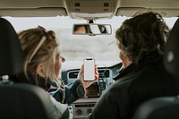 Senior tourist woman holding her smartphone with design space