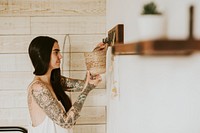 Woman hanging basket holder on the wall