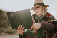 Senior woman reading a book as a hobby