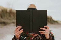 Woman enjoying her reading hobby outdoors