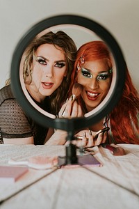 Drag queen beauty blogger recording a makeup tutorial video