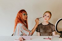 Show artist applying makeup tutorial video, beauty blogger