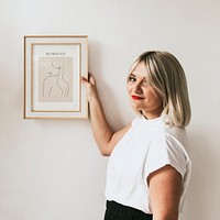 Woman holding frame mockup psd