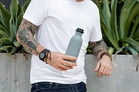 Tattooed man with gray insulated water bottle