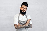 Cool barber in gray apron psd, half body