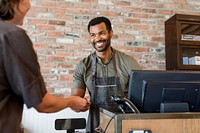 Receptionist taking payment for the customers