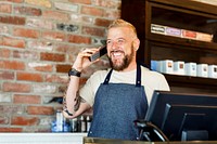 Barber taking a call from customer