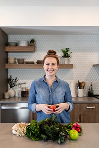 Woman with healthy vegetables in a kitchen