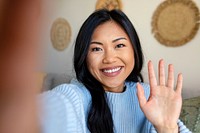 Woman saying hello, distance relationship through video call