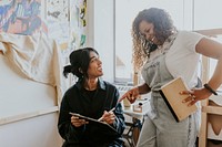 Woman artists collaborating together in their art studio