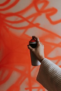 Hand spray paint a red wall