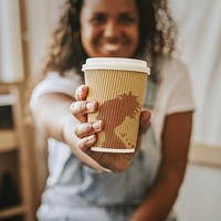 Paper coffee cup mockup psd  being held by a woman 