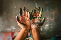 Hands covered in paint 